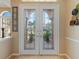 Double front doors with beveled glass accents at 5378 Legend Hills Ln, Spring Hill, FL 34609