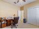 Bedroom with desk, chair, and double closets at 5378 Legend Hills Ln, Spring Hill, FL 34609