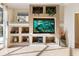 Built-in entertainment center with shelving and ample storage at 5378 Legend Hills Ln, Spring Hill, FL 34609