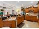Kitchen boasts a large island with granite countertops and stainless steel appliances at 5378 Legend Hills Ln, Spring Hill, FL 34609