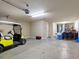 Spacious garage with plenty of room for storage and golf cart at 5378 Legend Hills Ln, Spring Hill, FL 34609