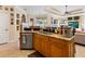 Spacious kitchen with an island, granite countertops, and stainless steel appliances at 5378 Legend Hills Ln, Spring Hill, FL 34609