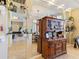 Entryway with a large mirror and a wood hutch showcasing decorative items at 5378 Legend Hills Ln, Spring Hill, FL 34609