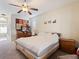King-size bed, ample closet space and bathroom access at 5378 Legend Hills Ln, Spring Hill, FL 34609