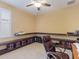 Home office with built-in shelves and a comfortable chair at 5378 Legend Hills Ln, Spring Hill, FL 34609