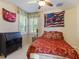 Guest bedroom with a double bed and racing decor at 5378 Legend Hills Ln, Spring Hill, FL 34609