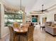 Breakfast nook with a round table, overlooking the pool area at 5378 Legend Hills Ln, Spring Hill, FL 34609