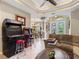 Gathering room with sectional sofa, game consoles and dining room view at 5378 Legend Hills Ln, Spring Hill, FL 34609