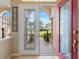 Open white double doors offering a view of backyard at 5378 Legend Hills Ln, Spring Hill, FL 34609