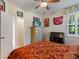 Bedroom with a double bed, dresser, and artwork at 5378 Legend Hills Ln, Spring Hill, FL 34609