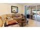 Relaxing Gathering room with sectional sofa, coffee table and pool access at 5378 Legend Hills Ln, Spring Hill, FL 34609