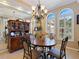 Dining room with a wooden hutch and four chairs at 5378 Legend Hills Ln, Spring Hill, FL 34609