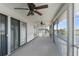 Large screened porch with ceiling fans, overlooking the water at 3407 Palometa Dr, Hernando Beach, FL 34607