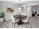 Modern dining room with wood table and white chairs at 12368 Killian St, Spring Hill, FL 34609