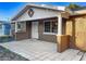 House exterior featuring a tiled patio and stone facade at 13912 Sommers Ave, Hudson, FL 34667