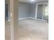 Spacious Gathering room with sliding glass doors at 13912 Sommers Ave, Hudson, FL 34667