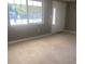 Spacious living room with large window at 13912 Sommers Ave, Hudson, FL 34667