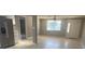 Bright living room with new flooring and fresh paint at 13912 Sommers Ave, Hudson, FL 34667