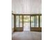 Bright sunroom with view of canal and dock at 13912 Sommers Ave, Hudson, FL 34667