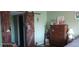Bedroom with dark wood dresser and barn door at 8210 Aquila St # 226, Port Richey, FL 34668