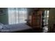 Bedroom with a view, neutral walls, and a dresser at 8210 Aquila St # 226, Port Richey, FL 34668