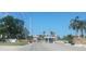 Gated community entrance with guard house and American flag at 8210 Aquila St # 226, Port Richey, FL 34668