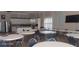 Community room with tables, chairs, and a full kitchen at 8210 Aquila St # 226, Port Richey, FL 34668