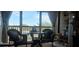 Small dining area with wicker chairs and balcony access at 8210 Aquila St # 226, Port Richey, FL 34668