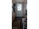 Inviting entryway with stained glass door and dark hardwood floors at 8210 Aquila St # 226, Port Richey, FL 34668