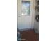 Inviting condo entry with a decorative glass door and tiled flooring at 8210 Aquila St # 226, Port Richey, FL 34668