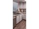 Kitchen with grey cabinets, light countertops, and a double sink at 8210 Aquila St # 226, Port Richey, FL 34668