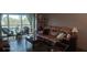 Living room features a comfortable recliner and access to a balcony at 8210 Aquila St # 226, Port Richey, FL 34668