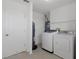 Laundry room with washer, dryer, and extra storage at 3480 Croaker Dr, Hernando Beach, FL 34607