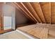 An unfinished attic space with exposed wood beams, ready to be finished to your liking at 5537 Sea Forest Dr # 307, New Port Richey, FL 34652