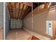 Unfinished attic space with wooden flooring and exposed insulation at 5537 Sea Forest Dr # 307, New Port Richey, FL 34652