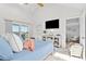 Serene bedroom with natural light, a sliding glass door, and sitting area at 5537 Sea Forest Dr # 307, New Port Richey, FL 34652