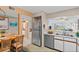 Functional eat-in kitchen with stainless steel appliances and an open floor plan at 5537 Sea Forest Dr # 307, New Port Richey, FL 34652