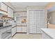 Functional kitchen design with white cabinetry and stainless steel appliances at 5537 Sea Forest Dr # 307, New Port Richey, FL 34652