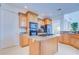 Kitchen with island, granite countertops, and wood cabinets at 7352 Gulf Way, Hudson, FL 34667