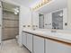 Bathroom boasts dual vanity sinks and a walk-in shower at 5537 Sea Forest Dr # 307, New Port Richey, FL 34652