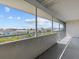 Spacious screened balcony overlooking neighborhood and trees at 5537 Sea Forest Dr # 307, New Port Richey, FL 34652