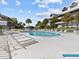 Community pool with plenty of lounge chairs at 5537 Sea Forest Dr # 307, New Port Richey, FL 34652