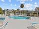 Refreshing community pool with ample seating at 5537 Sea Forest Dr # 307, New Port Richey, FL 34652