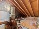Unfinished attic space with exposed insulation and storage items at 5537 Sea Forest Dr # 307, New Port Richey, FL 34652