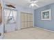 Guest bedroom with light blue walls and a large closet at 5537 Sea Forest Dr # 307, New Port Richey, FL 34652