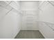 Large walk-in closet with wire shelving at 329 Sunset Way, Palm Harbor, FL 34683