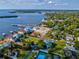 Wide aerial showcasing waterfront property, marina, and lush landscape at 329 Sunset Way, Palm Harbor, FL 34683