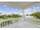 Another view of the expansive balcony with neighborhood and water views at 329 Sunset Way, Palm Harbor, FL 34683