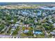 Aerial view of a two-story home nestled in a quiet residential area at 329 Sunset Way, Palm Harbor, FL 34683