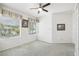 Well-lit bedroom with carpet flooring and built-in shelving at 329 Sunset Way, Palm Harbor, FL 34683